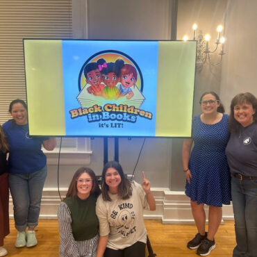 Six members volunteering at the Carnegie Center for Literacy