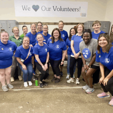 Large group volunteering at God's Pantry