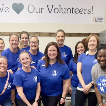 Large group volunteering at God's Pantry